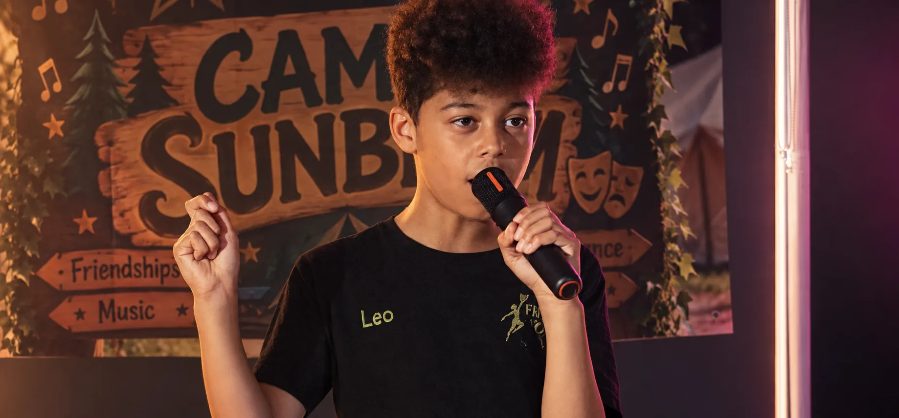 Young performer singing on stage